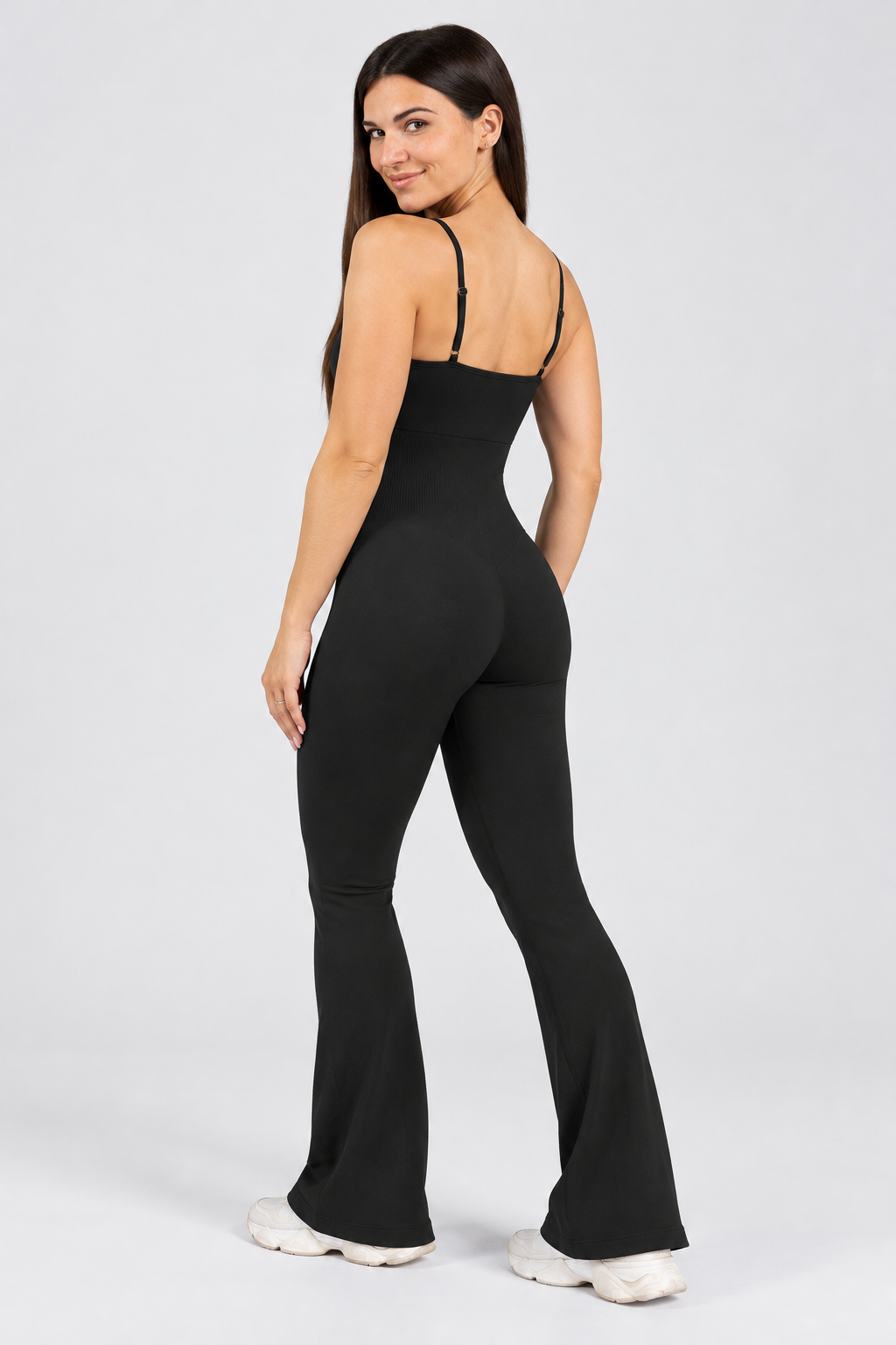 Contour flared cami jumpsuit in black, back view with adjustable straps