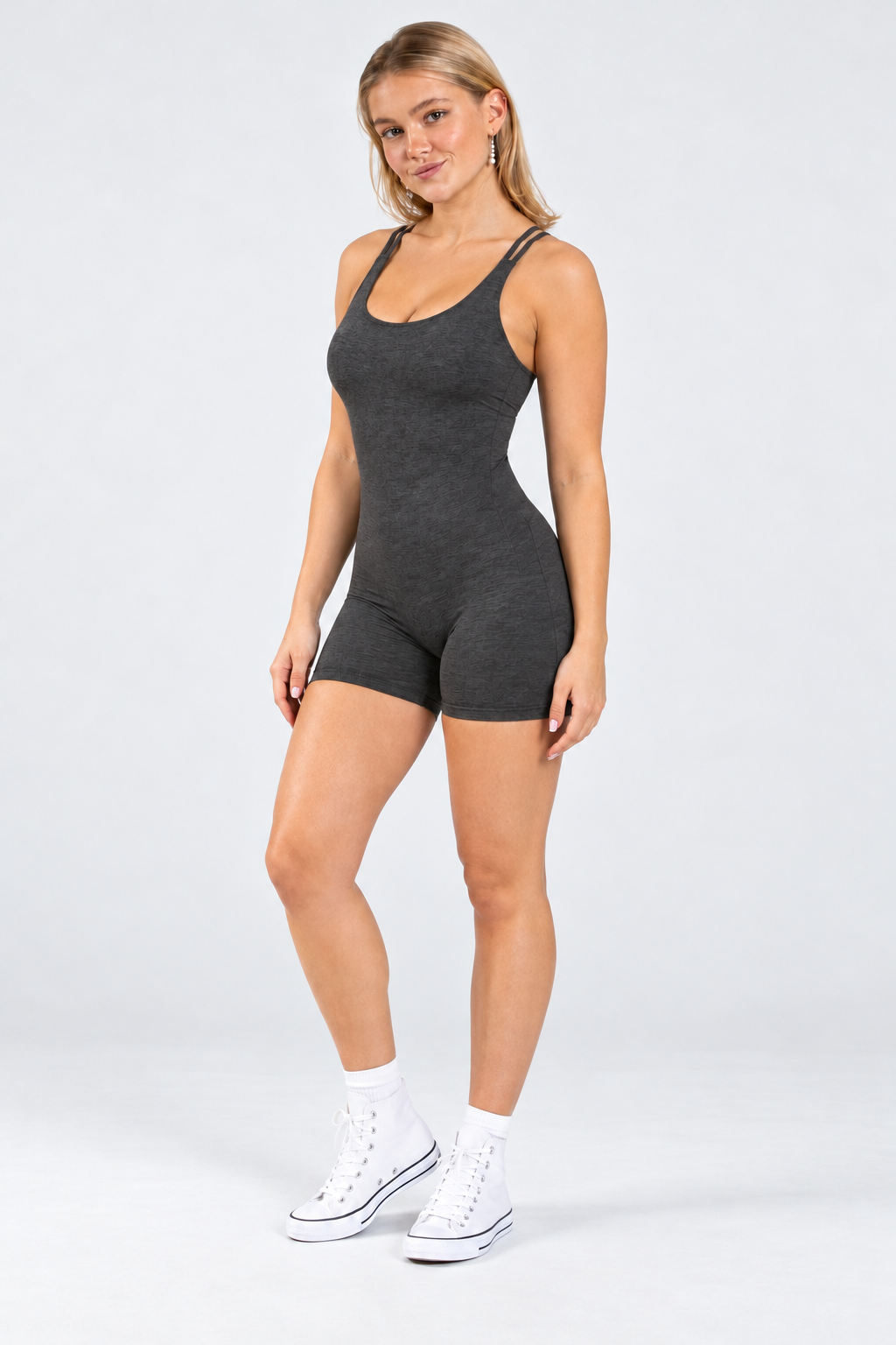 Strappy open back romper in charcoal, angled front view
