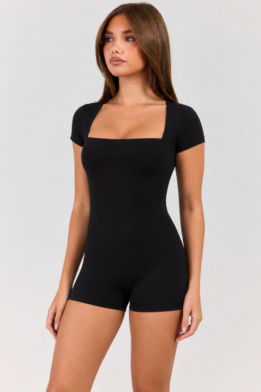 Bexia petite square neck short sleeve romper in black, angled front view